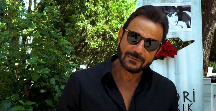 Kerem Alışık in a black goggles and black shirt.